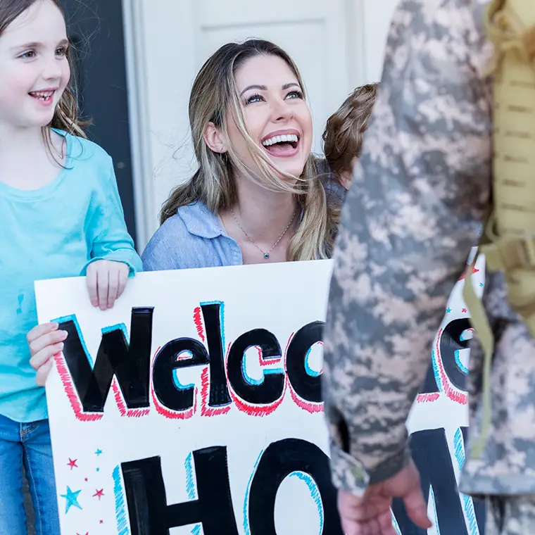 SCH-Communities-01 Family welcoming service member home